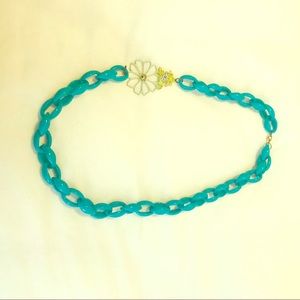 Green chunky necklace with frog & flower detail